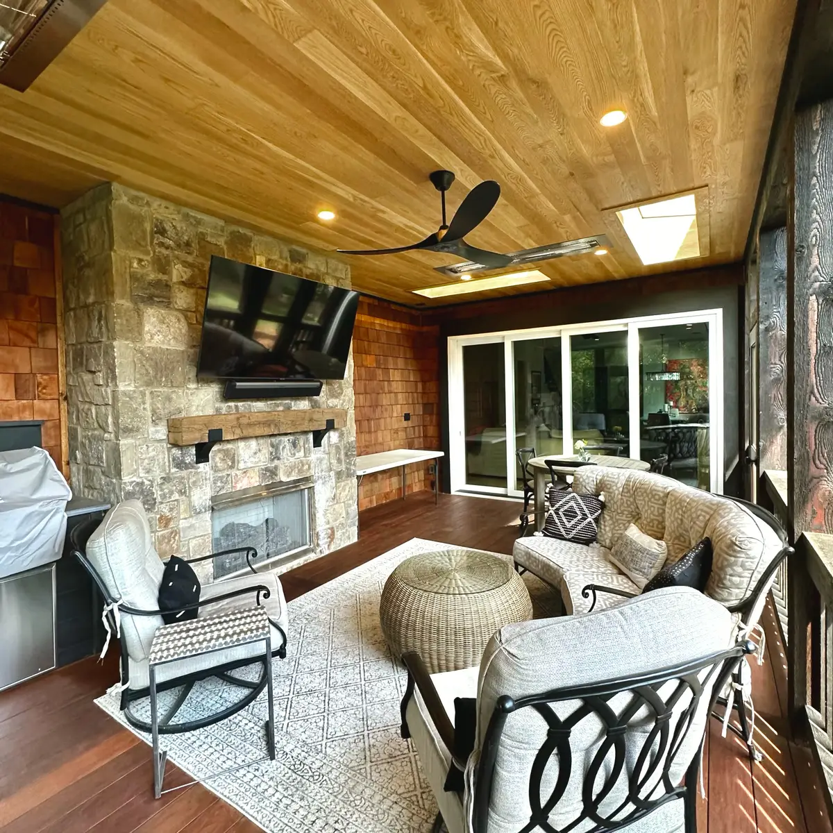 Custom screened porch with vaulted ceiling and composite decking built by West GA Decks